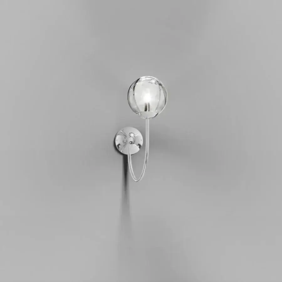 Refined Vistosi Puppet wall lamp crafted in clear glass with high-end metal parts and glossy chrome finish