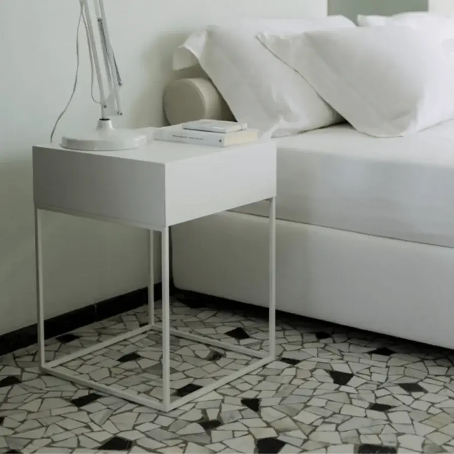 Sophisticated Porada Baby side table in matte white with a minimalist metal base and refined lines