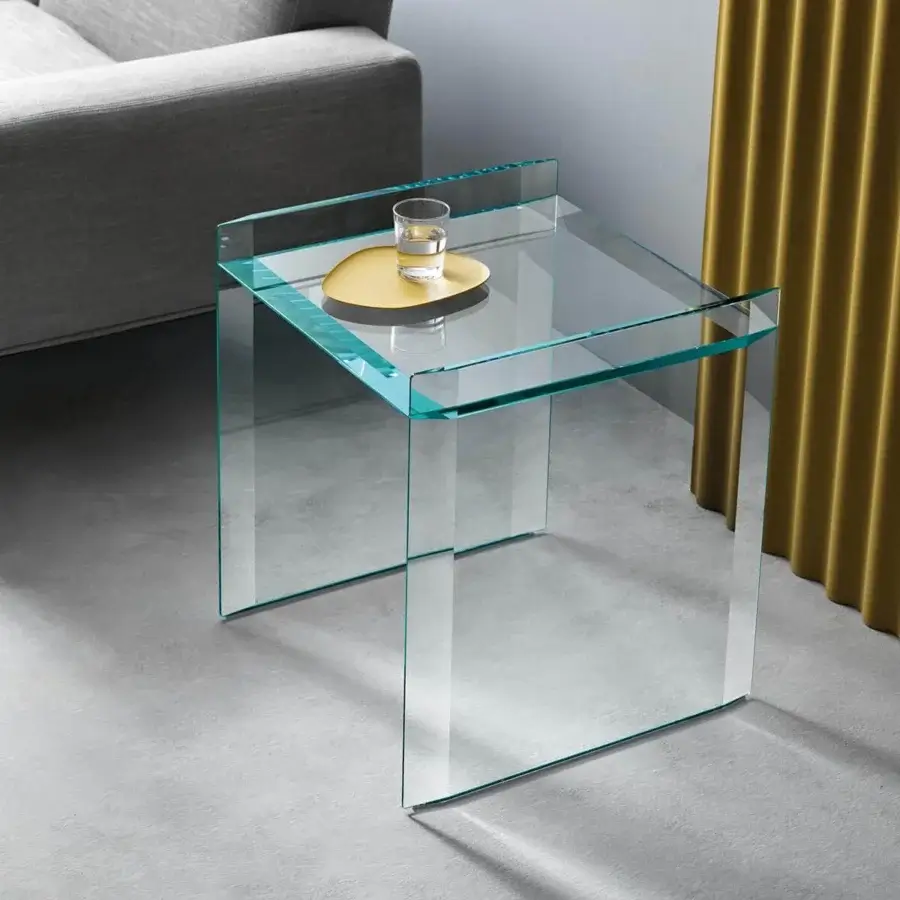 Exclusive Tonelli Design Quiller side table in extra clear glass with stylish bevelings enhancing its geometric form