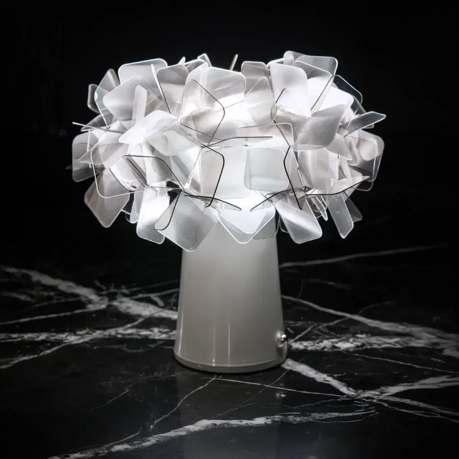 Superior Slamp Clizia Battery Table Lamp lighting with interconnected translucent white plastic elements and a glossy conical base