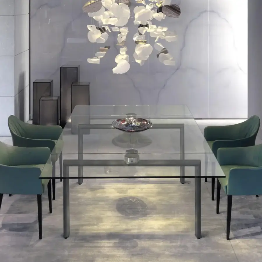 Elegant Reflex Peggy armchair with curved teal green refined fabric upholstery and matt nero beluga lacquered wood legs