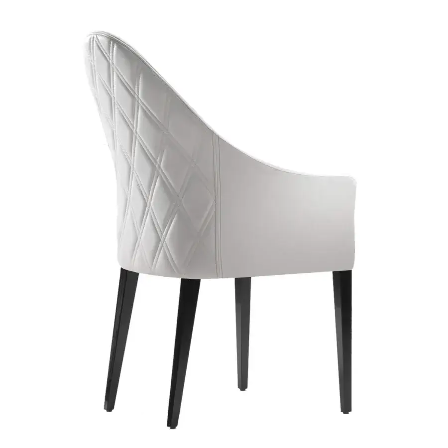 Distinguished Reflex Peggy armchair with refined white synthetic leather and diamond quilting on a curved silhouette built with nero beluga lacquered wood legs
