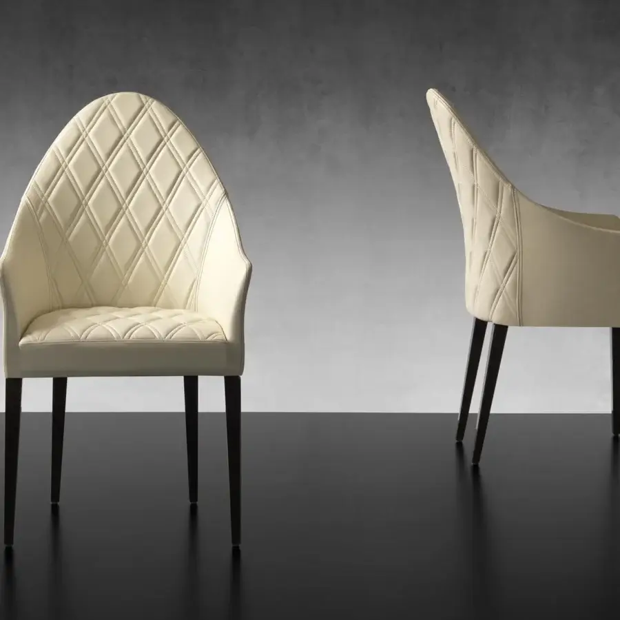 Exceptional Reflex Peggy armchair with light cream fabric upholstery and matt nero beluga lacquered wooden legs