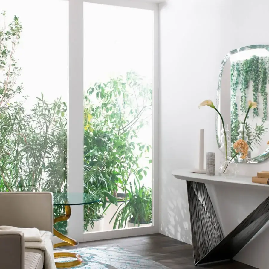 Elegant Reflex Seventy mirror crafted from extra-clear glass with a beveled edge and rounded rectangular silhouette