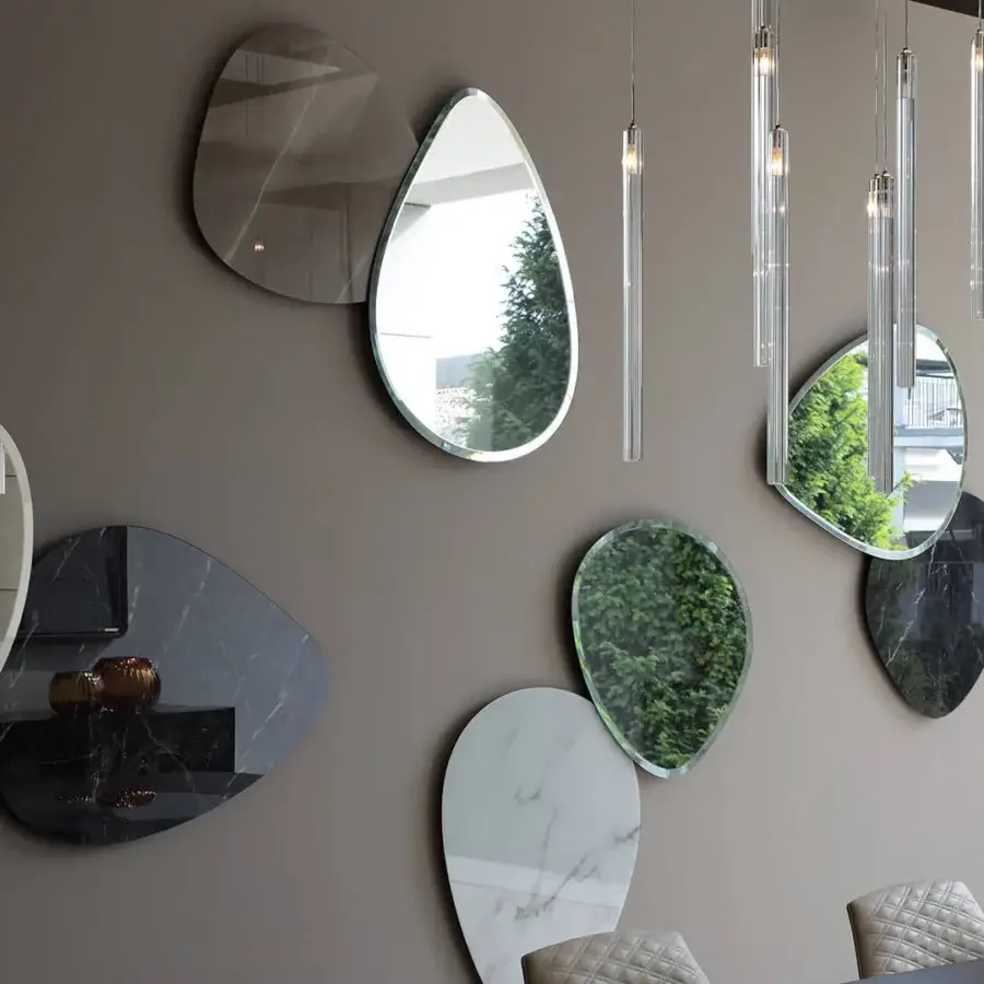 Distinguished Reflex Seventy mirror crafted in extra-clear glass with beveled edges and reflective silver, gray, black and white palettes