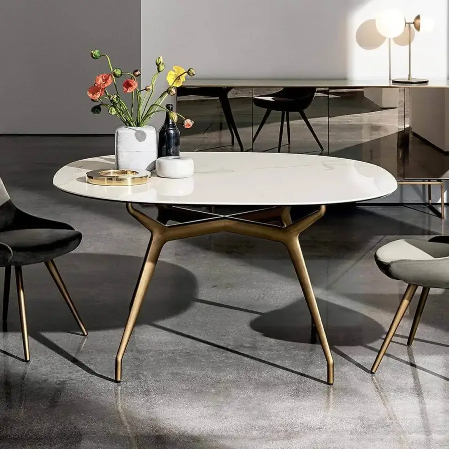 Distinguished Sovet Italia Arkos table with refined oval tabletop and die-cast aluminum base in golden toned finish