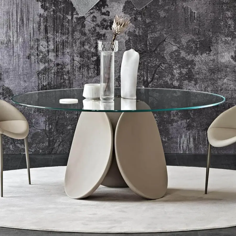 Exceptional Cattelan Italia Maxim table with sculptural cement base and clear glass top in a spatuated finish