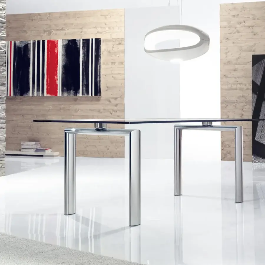 Elegant Reflex Policleto table with transparent tempered glass top and oval metal legs in high-gloss clear and silver finish