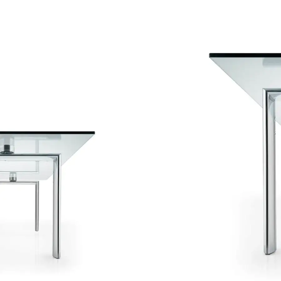 Distinguished Reflex Policleto table with transparent tempered glass top and highly reflective metal frame built with cylindrical connectors