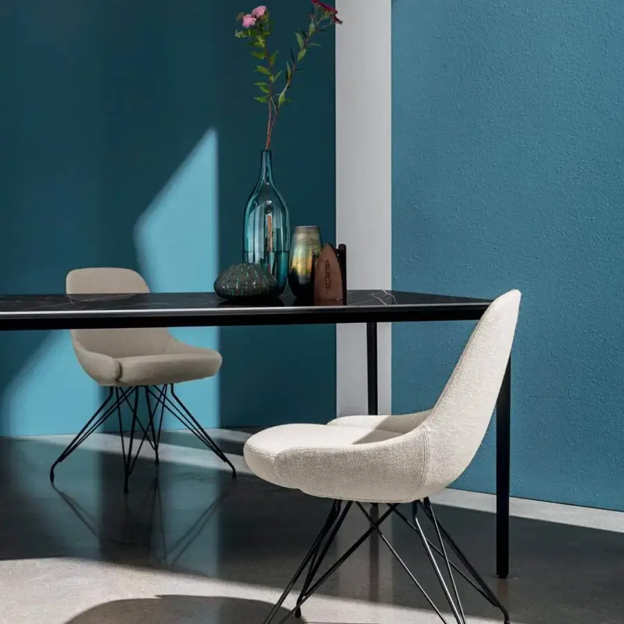 Superior Sovet Italia Cadira chair with light beige textile upholstery and black lacquered metal base