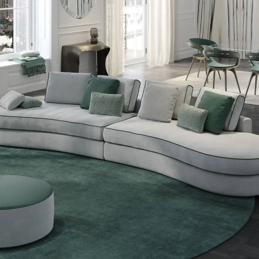 Refined Reflex Adone sectional upholstered in light gray textile with green trim and goose feather cushions crafted in Italy