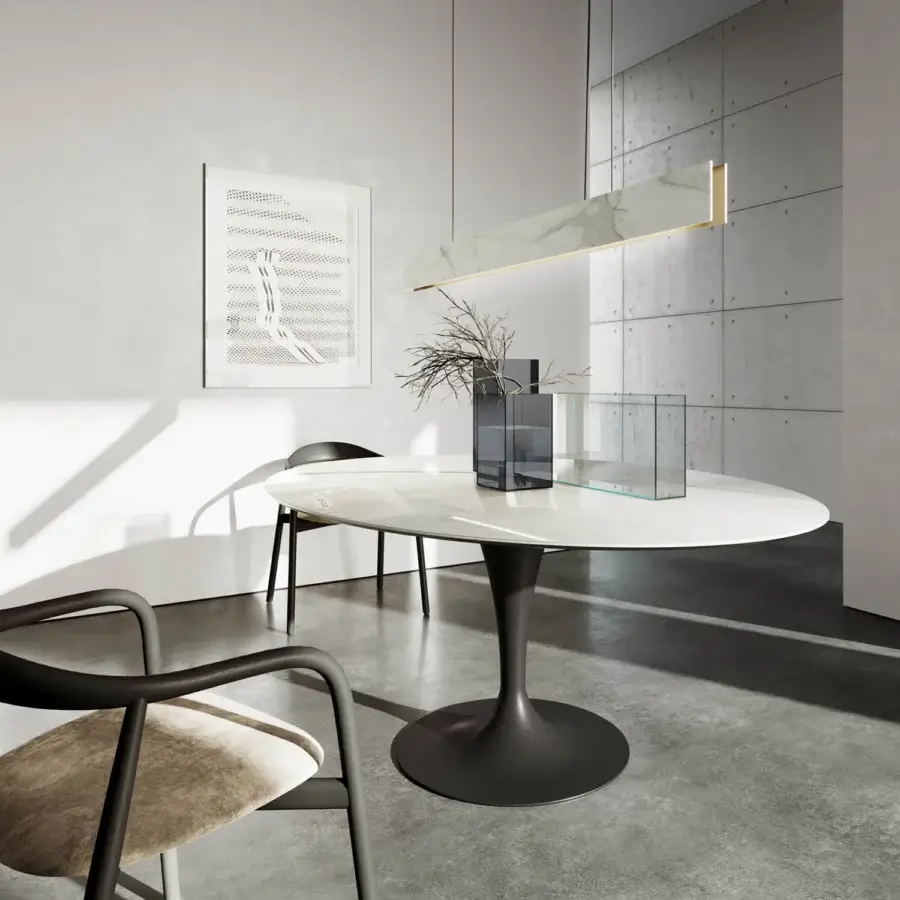 Elegant Sovet Italia Flute elliptical table with light stone composite top and dark gray lacquered metal tulip base