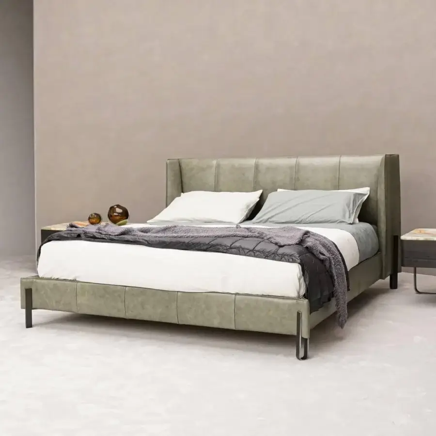 Distinguished Arketipo Big Night bed with muted green synthetic leather upholstery and matte finish featuring angular metal clasps