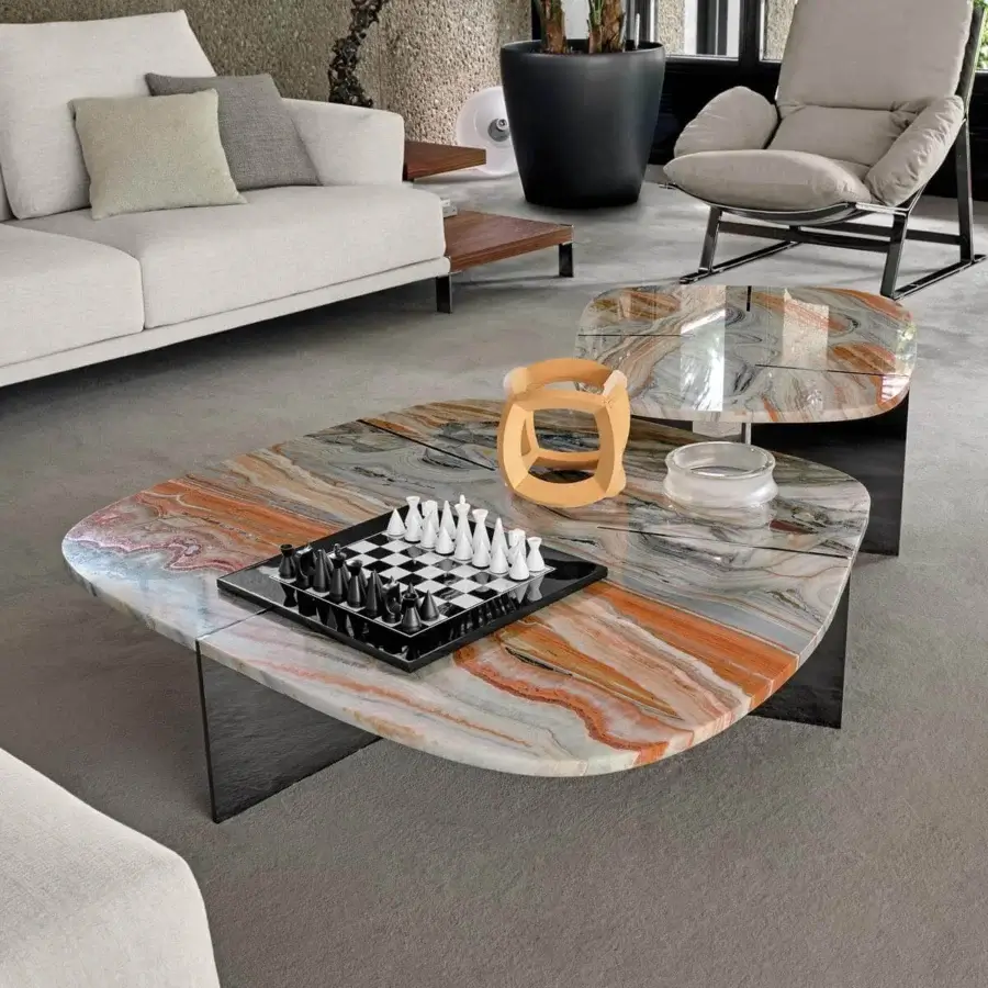 Captivating Arketipo Rumors coffee table with curvaceous marble surface and intersecting metal blades in orange, gray, and white tones