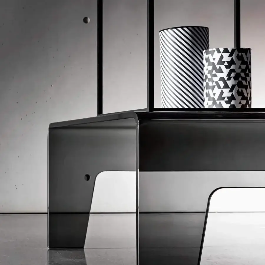 Distinguished Sovet Italia Frog coffee table with lacquered bent glass and a glossy dark gray finish showcasing a geometric silhouette