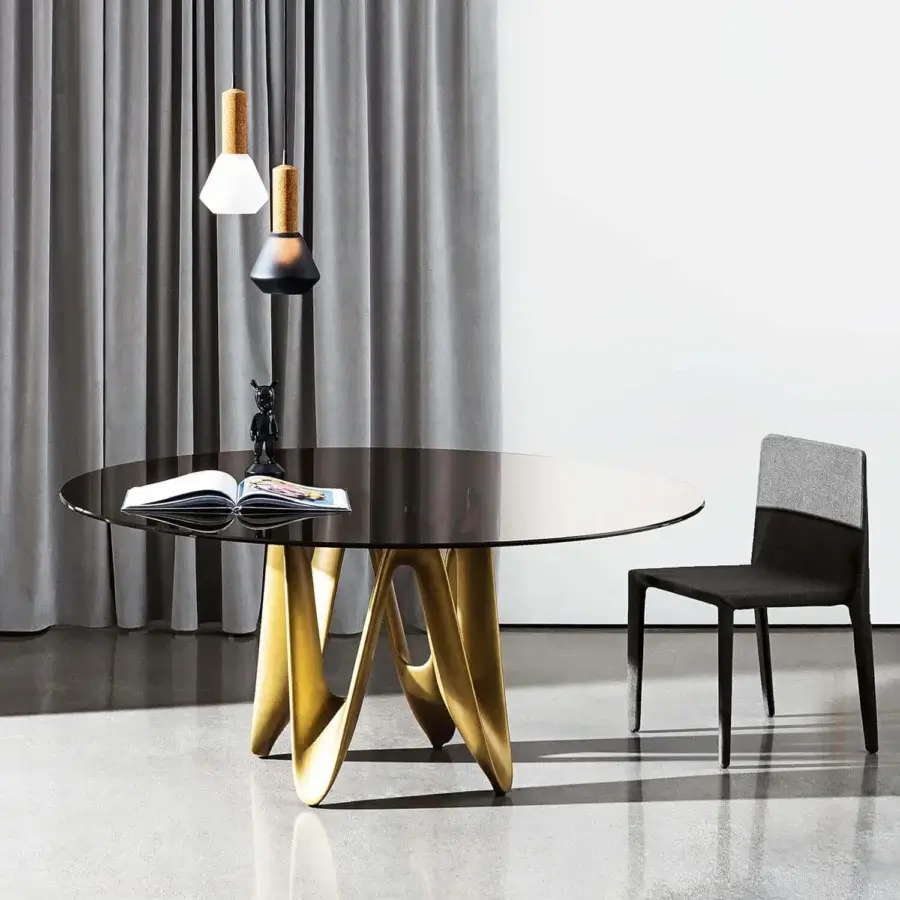 Distinguished Sovet Italia Lambda table with reflective tempered glass and lustrous metallic gold Cristalplant base