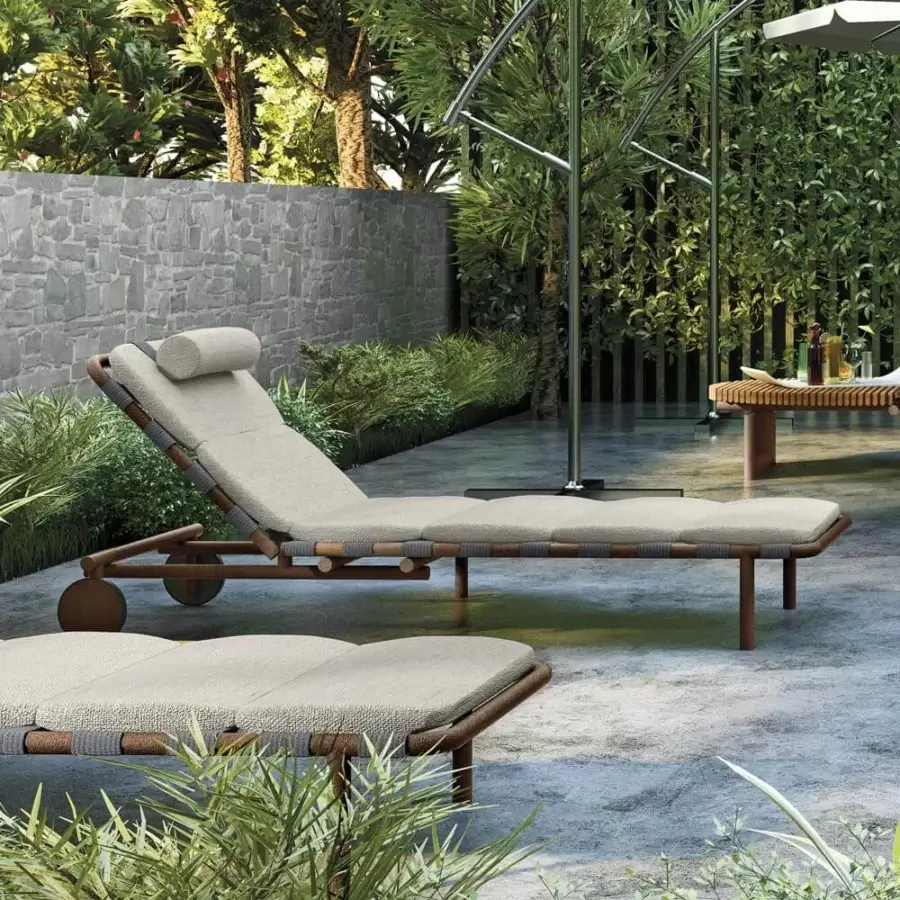 Stylish Arketipo Argentario lounger with woven light-colored textile and slender wooden legs crafted in Italy with a side table