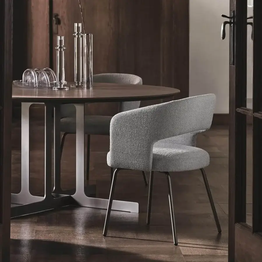 Distinguished Ditre Italia Nell table with a dark brown marble top and light gray metal blades in a cruciform design with matte finish