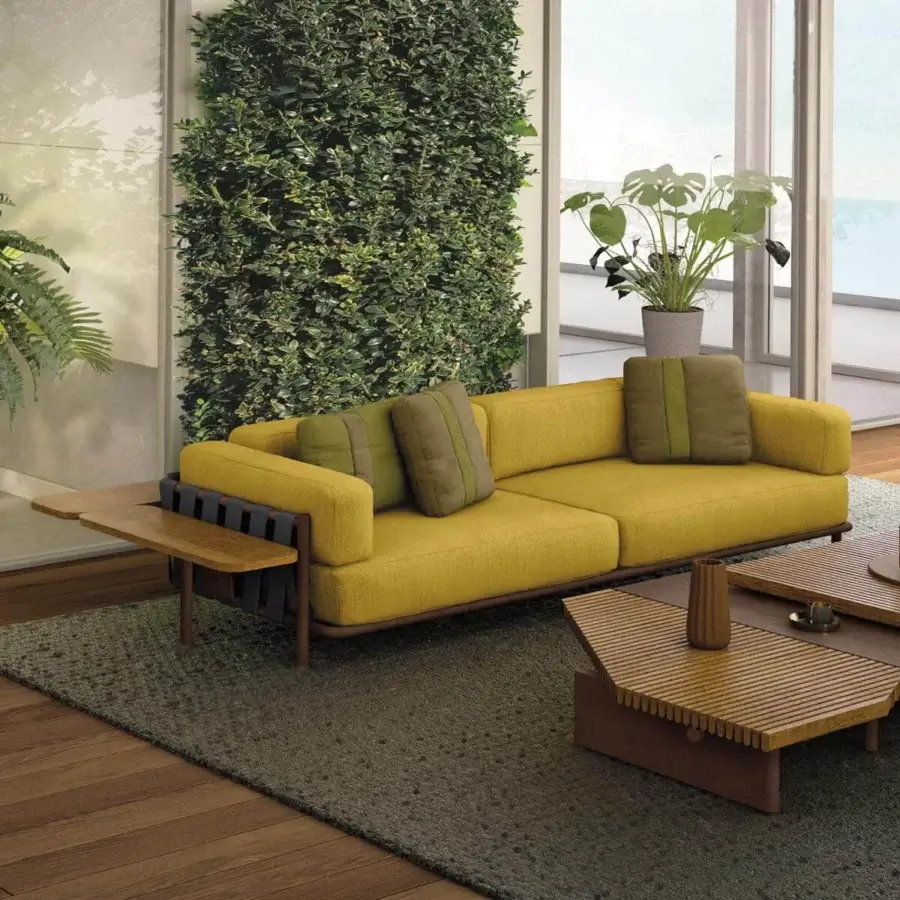 Exclusive Arketipo Punta Ala sofa with woven backrest and textured yellow textile upholstery accented with olive-green pillows