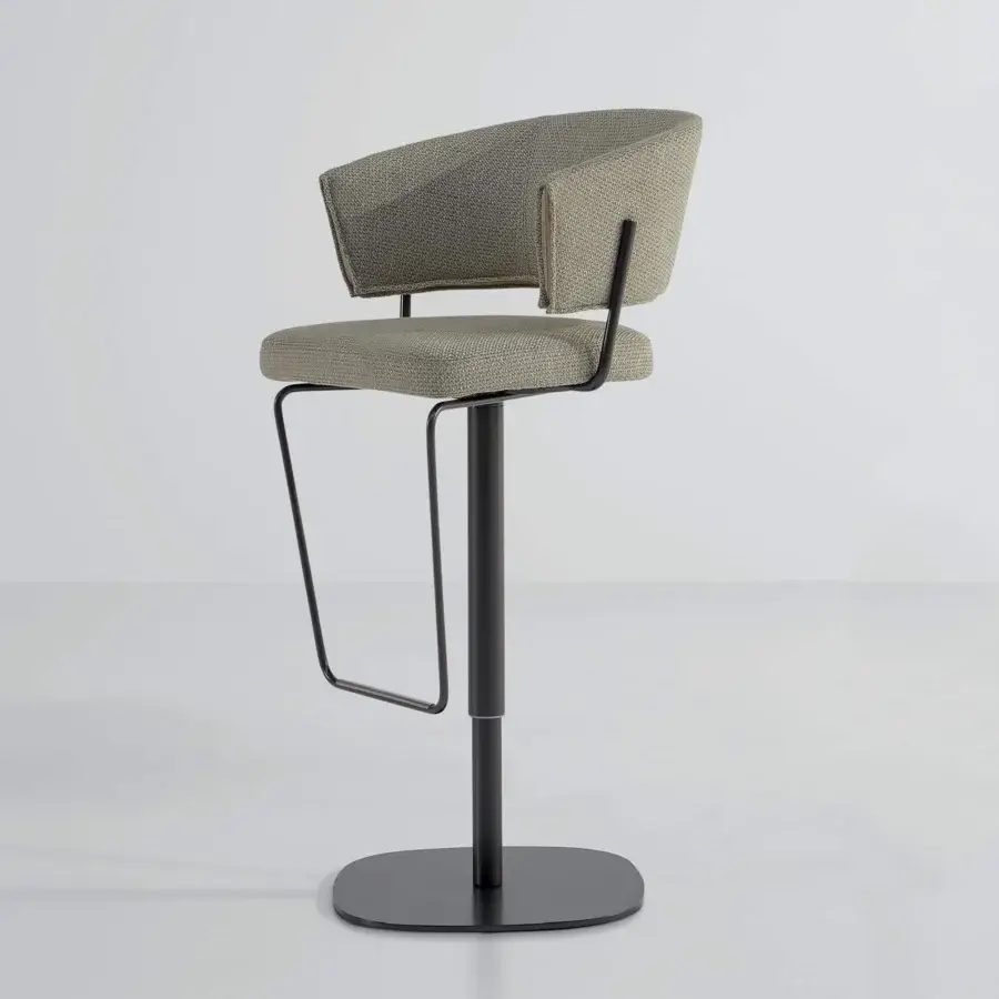 Vertical seating form with circular base, textured light material, and slender cylindrical support against a pale gray backdrop