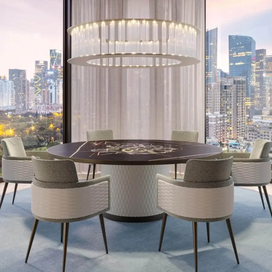 Refined Reflex Big Ben table with cylinder base upholstered in geometrically-patterned quilted leather and dark stone-like tabletop with gold inlay