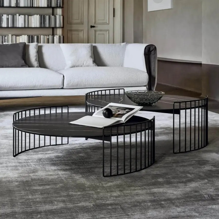 Superior Bonaldo Harpe coffee table with matte black metal base and dark stone-like tabletop exhibiting subtle light veining