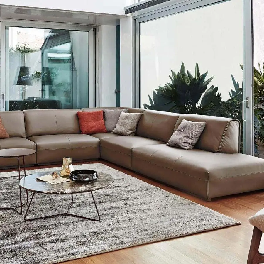 Distinguished Ditre Italia Monolith sectional upholstered in smooth taupe leather-like material with wide cushions and stylish neutral accents