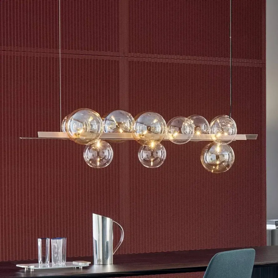 Distinguished Bonaldo Bon Ton suspension lamp with eleven glass lampshades—four amber and seven transparent—mounted on a metal bar