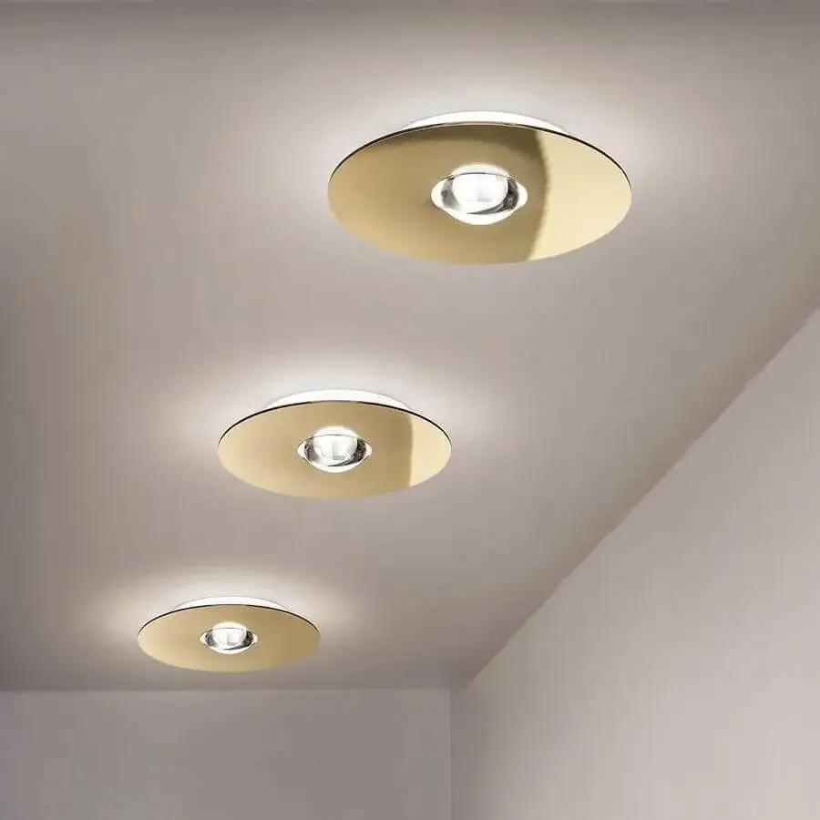 Distinguished Lodes Bugia ceiling lamp crafted in metal with a glossy golden-toned finish emits a soft gradient effect