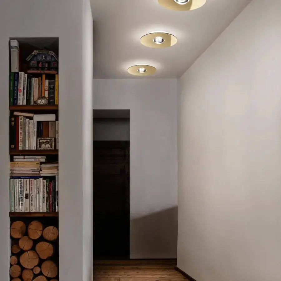 Exceptional Lodes Bugia ceiling lamp crafted from metal with a glossy finish radiating a warm golden glow