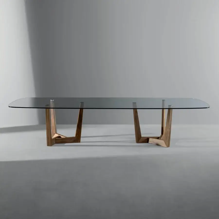 Elegant Bonaldo Art Wood table with transparent glass top and solid American walnut trapezoid bases in medium brown matte finish
