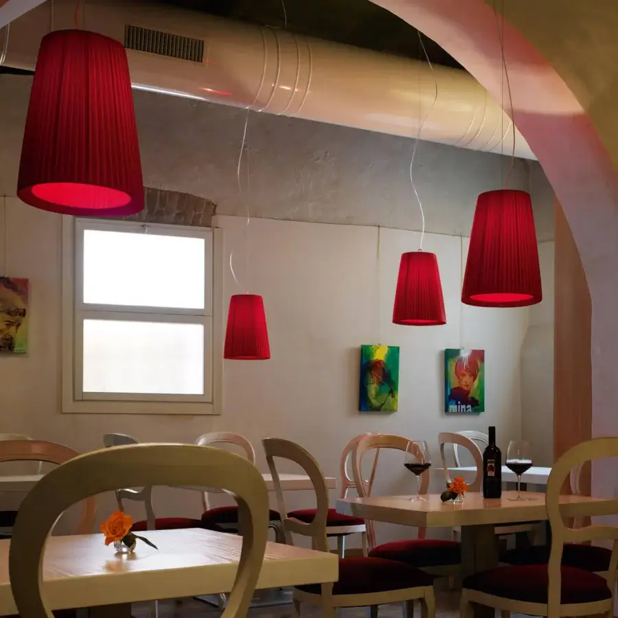 Elegant Modo Luce Florinda suspension lamp with red fabric petals offering ambient warmth in a minimalist design