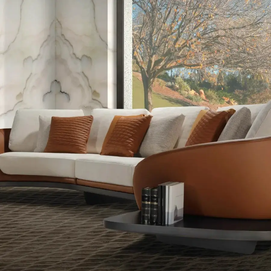 Distinctive Reflex Segno sofa with curved silhouette upholstered in light cream textile and bronze finished metal legs built with Canaletto Walnut
