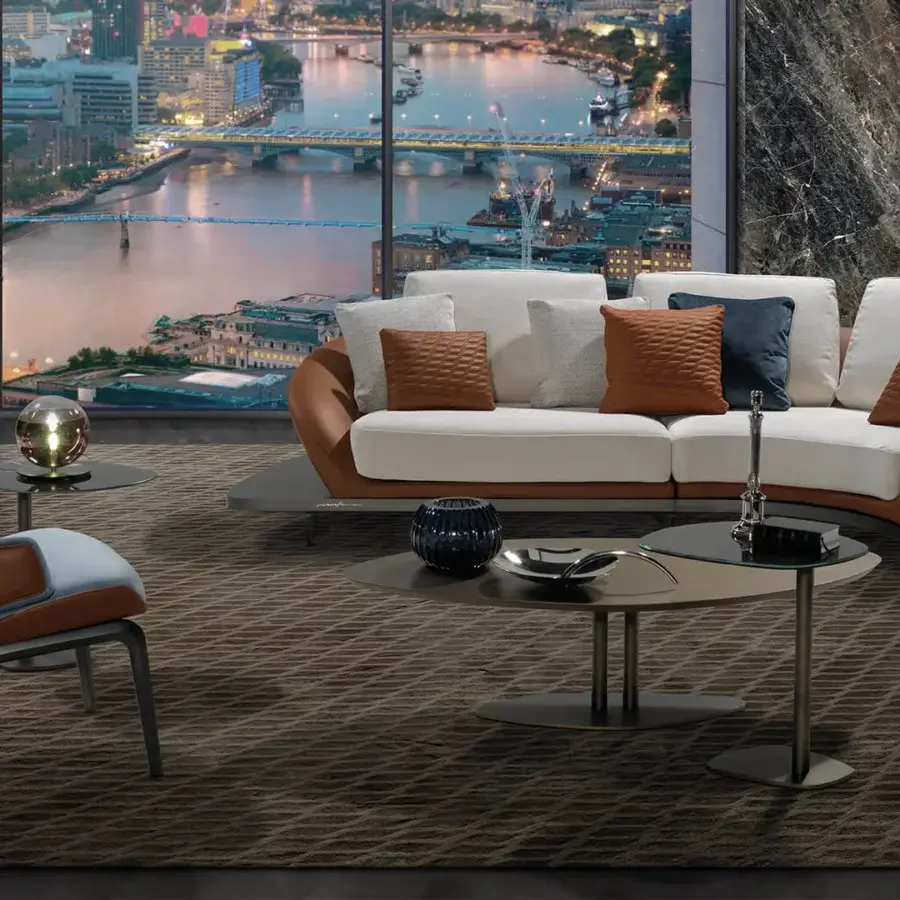 Distinguished Reflex Segno sofa with curved white textile upholstery, dark ash wood platform and bronze finished metal legs