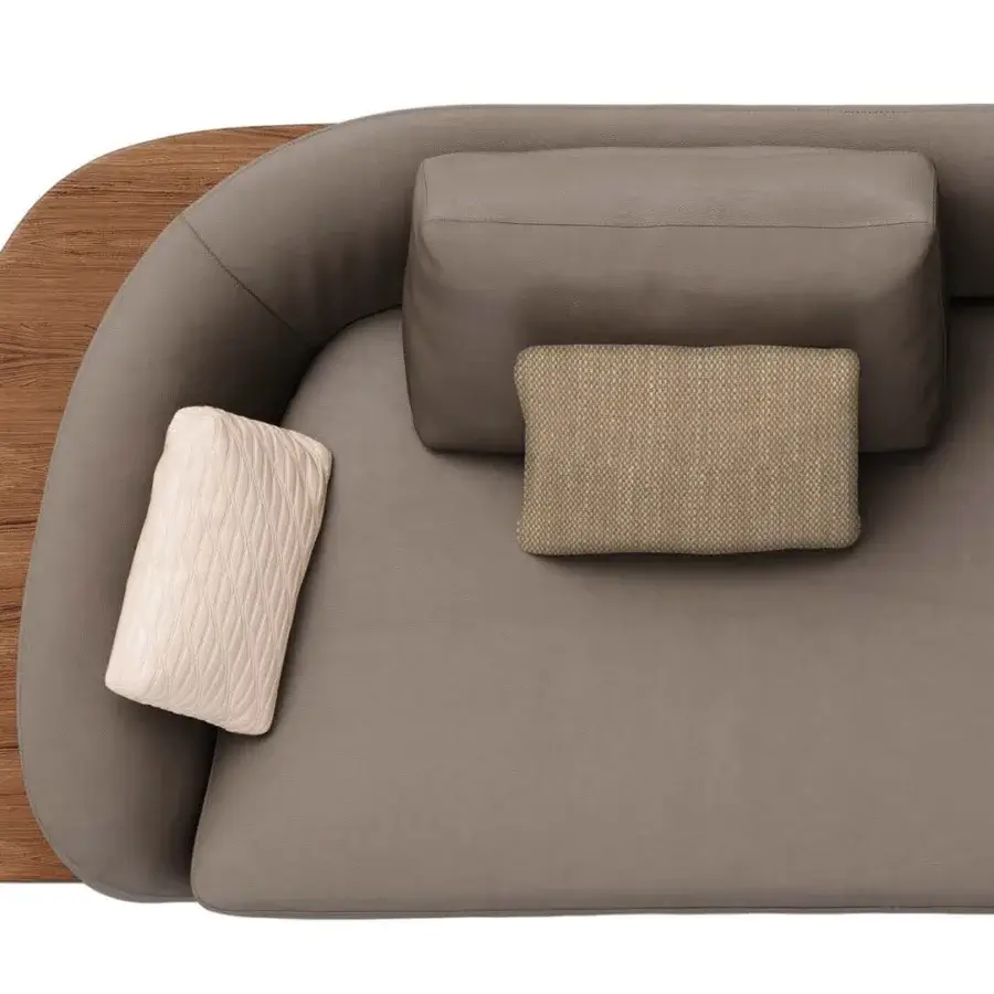 Elegant Reflex Segno sofa with curved form, smooth gray fabric upholstery and visible Canaletto Walnut with bronze metal legs