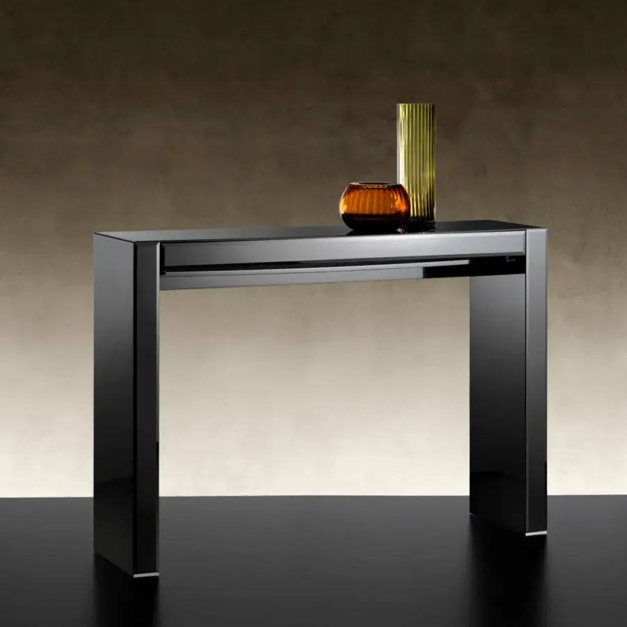 Avant-garde Reflex console crafted in shiny lacquered wood with bevelled lacquered glass top and drawer fronts exhibiting minimalist design