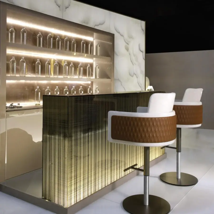Innovative Reflex Avantgarde bar with glossy dark countertop, lacquered shelving, and marbled backdrop showcasing clear glass bottles