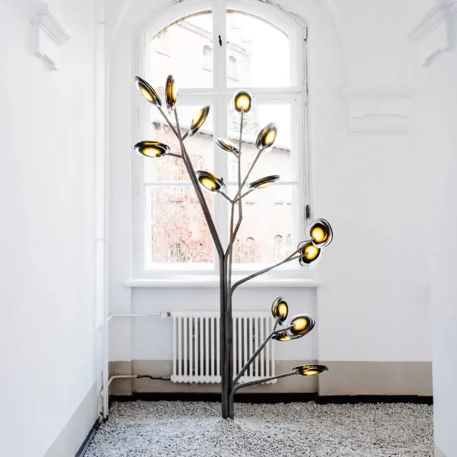 Exceptional Bocci 16 Tree floor lamp crafted with layered colored glass and smooth grey metal finish emitting a warm yellow glow
