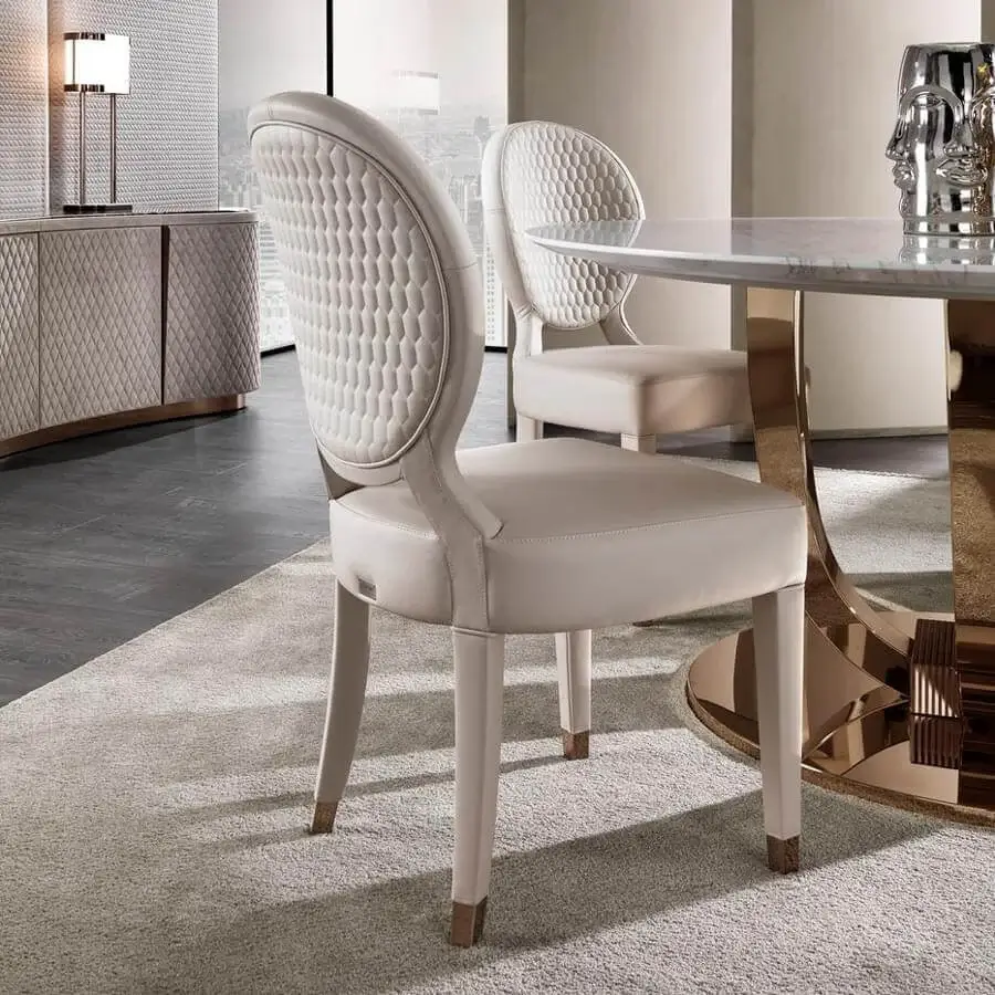Distinguished DV Home Collection Adler chair with light cream leather upholstery and quilted geometric detailing on a solid beech wood structure