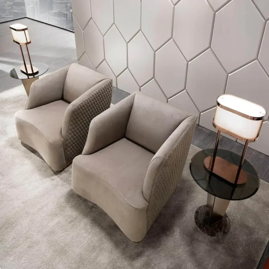 Elegant DV Home Collection Venice lounge chair in smooth beige fabric with refined hexagon quilting and sleek metal base