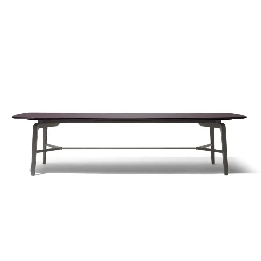 Distinguished Giorgetti Blade table in wood with polished striped finish and sleek gray legs with metal support