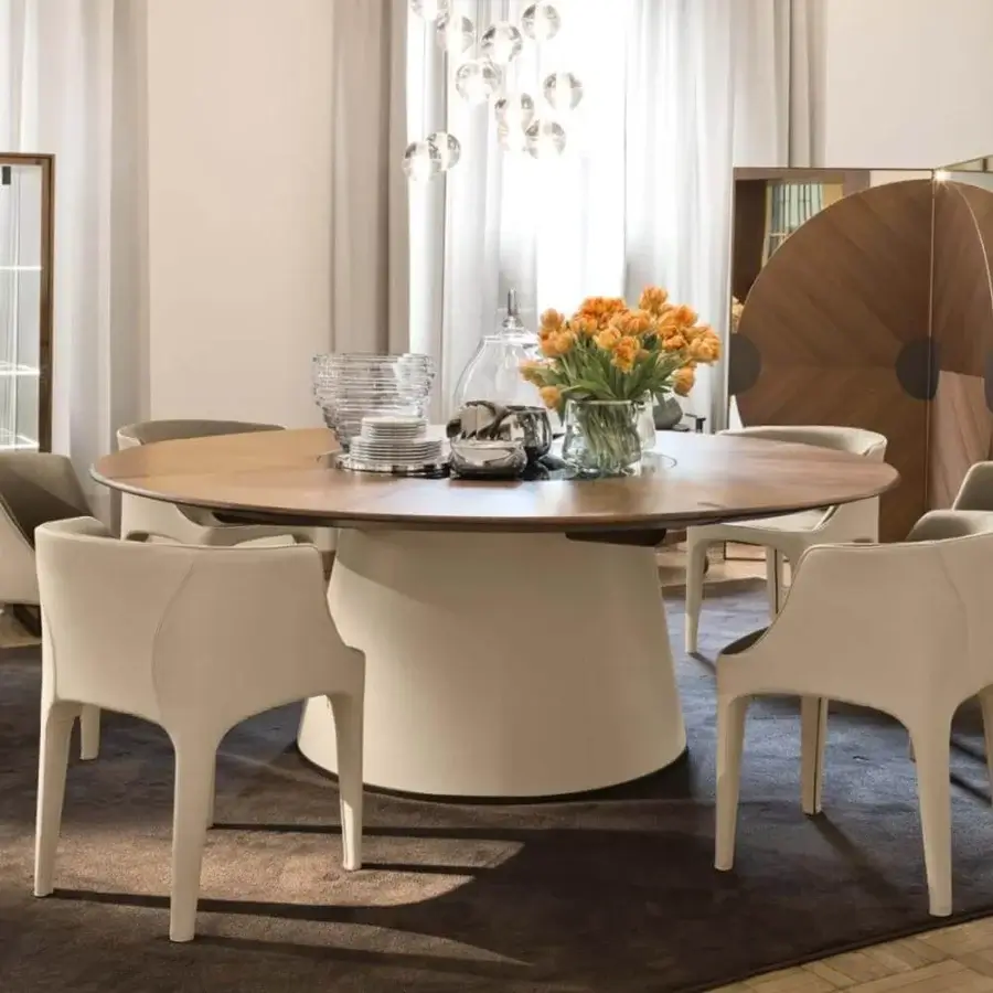 Elegant Giorgetti Fang round table crafted with Canaletto walnut and light cream leather, enhanced with painted glass