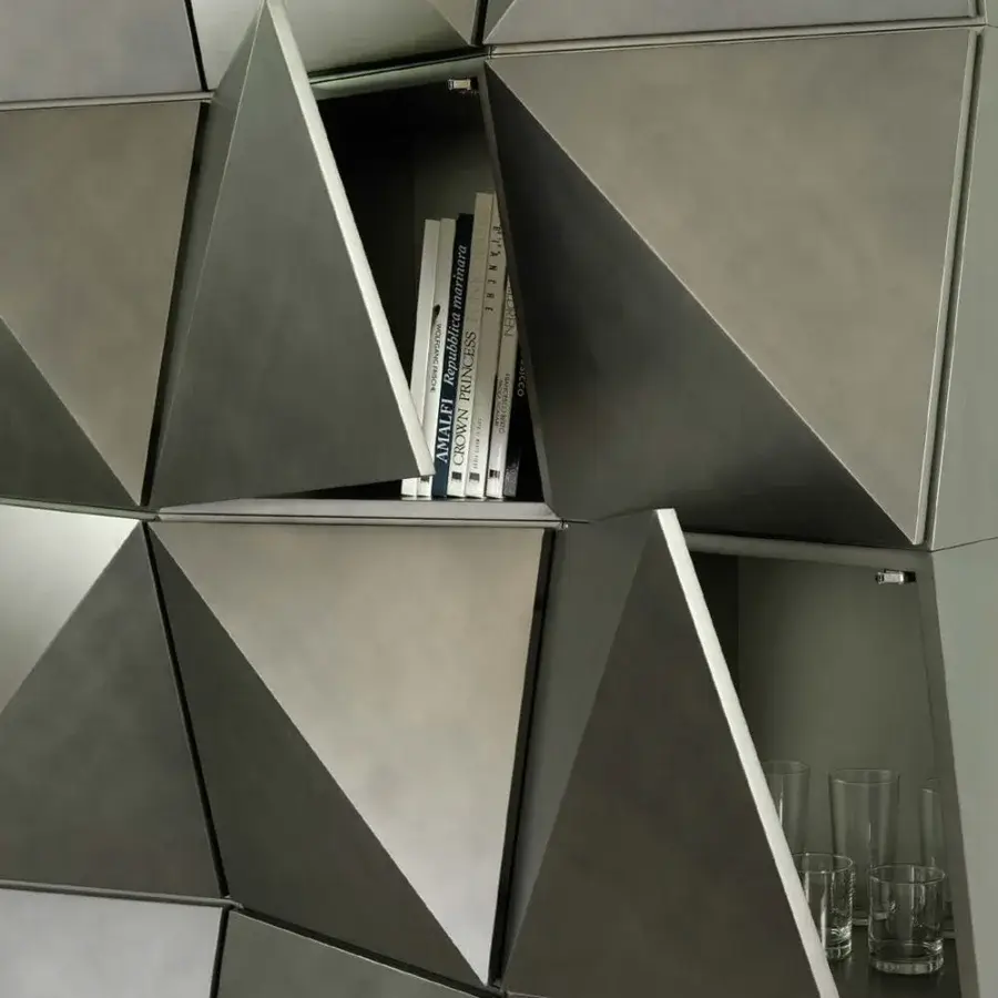 Elegant Reflex Origami wall unit presenting tessellated triangular compartments in matte medium-gray with metal finishing crafted in Italy