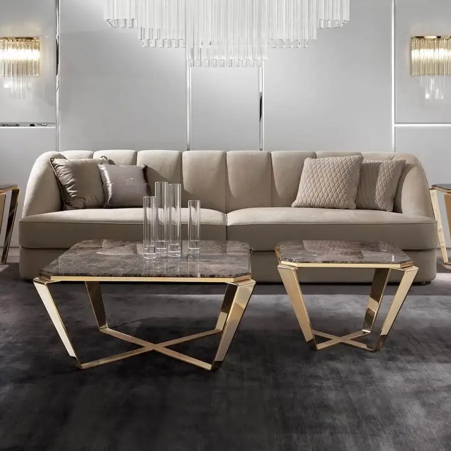 Sophisticated DV Home Collection Deco coffee table with dark brown marble top and glossy gold steel base