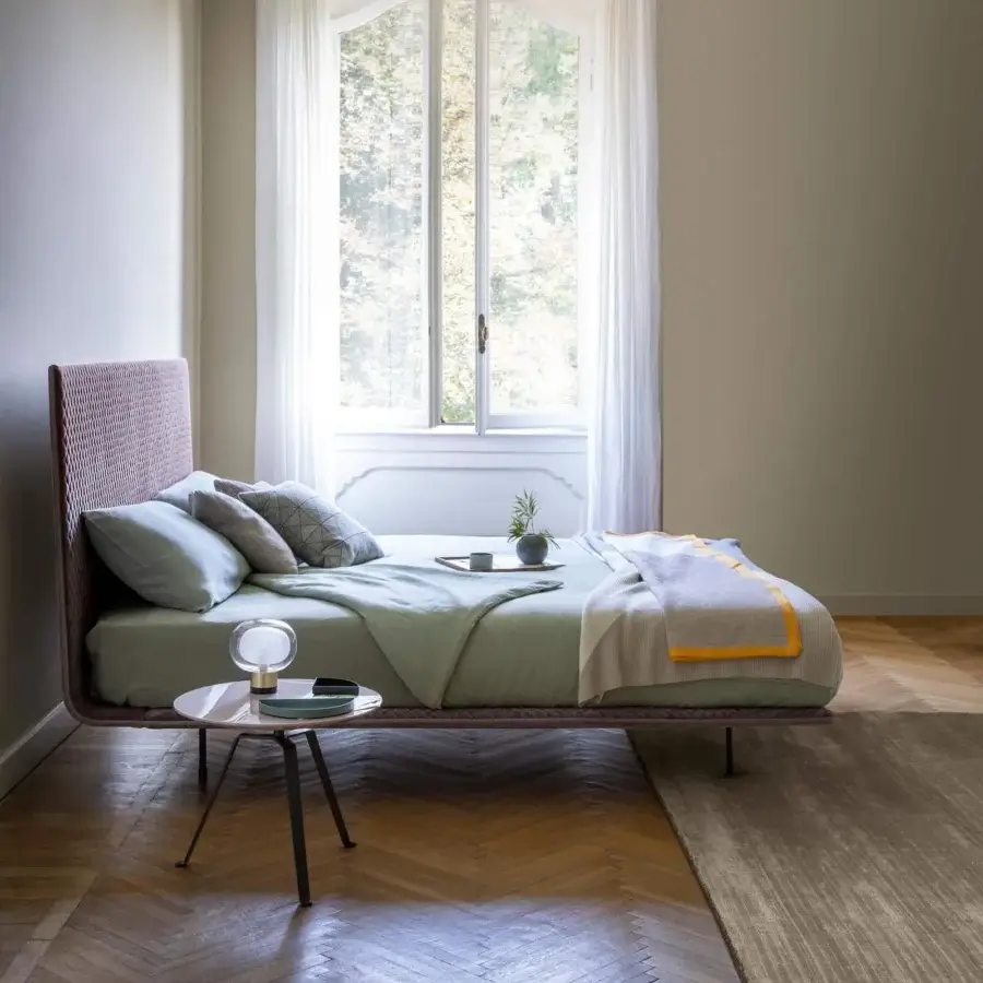 Distinguished Bonaldo Thin bed with a continuous line design upholstered in textured reddish-brown fabric and thin metal feet