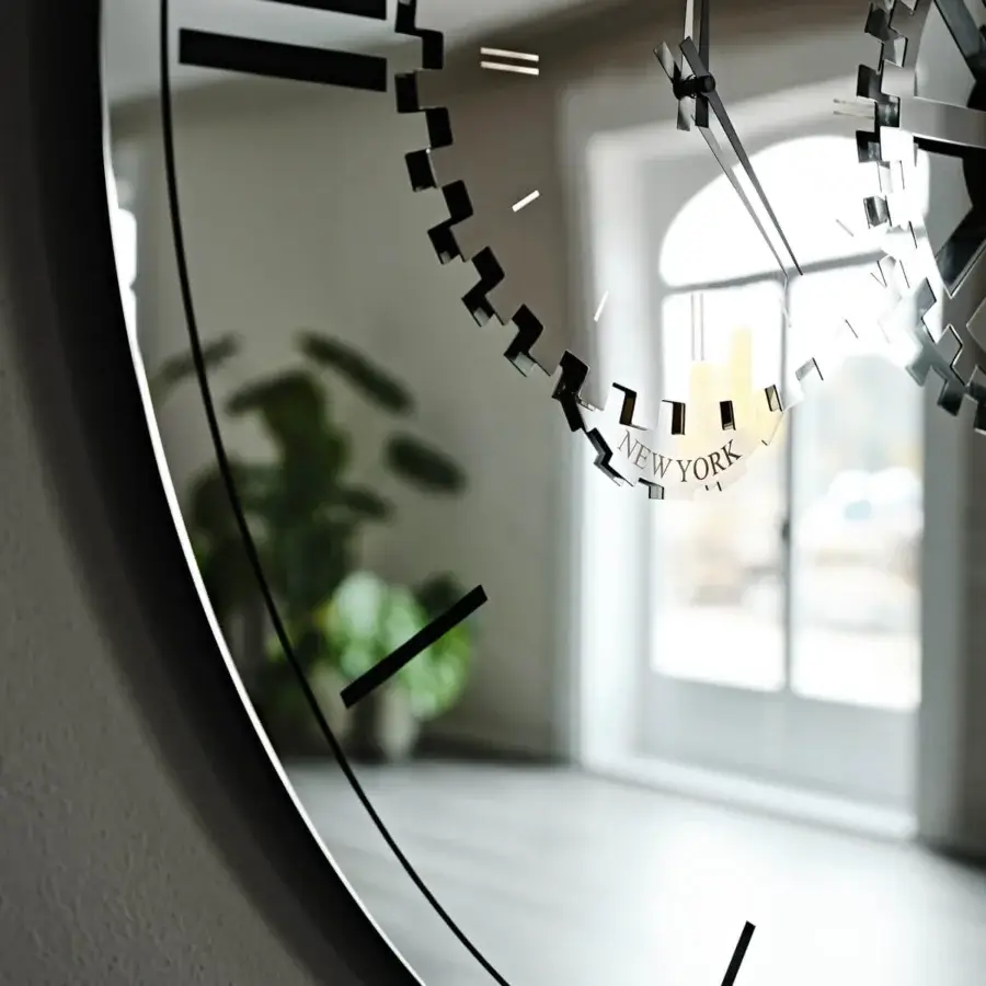 Elegant Cattelan Italia Times mirror crafted in mirrored glass with silk-screen printing and sleek steel details presenting a modern clock