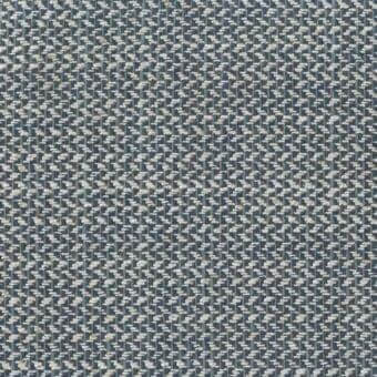 Woven fabric sample, muted blue-gray and beige, dense speckled pattern with nubby texture; “Chancas 218” printed along bottom edge.