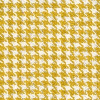 Mariani fabric, S Mamba 100, features a dense diagonal grid of mustard yellow and white irregular diamond shapes with a woven texture.