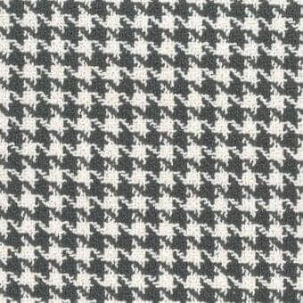 Houndstooth textile pattern in grayscale, featuring diamond motifs and a looped texture; Mariani “s mamba 180” fabric.