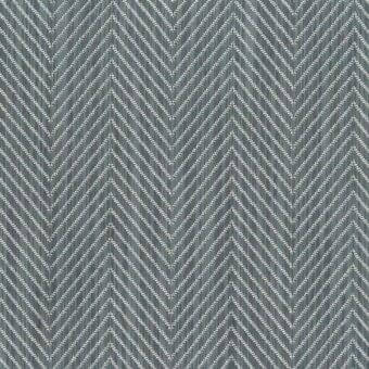 Herringbone fabric pattern in gray-blue and off-white tones, featuring angled lines and a subtle woven texture; Mariani "S Susy" textile.